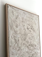Load image into Gallery viewer, detail shot of off-white, 'wabi-sabi' style textured artwork framed in oak colour tray frame
